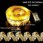 Gold and white Christmas ribbon string lights with star patterns, shown coiled and unrolled, battery pack attached