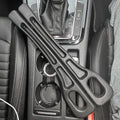 Pair of black foam car seat gap fillers placed on a car's center console between seats