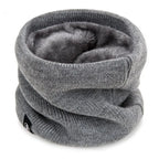 Grey knitted neck warmer with soft, plush lining, shown standing upright on a white background