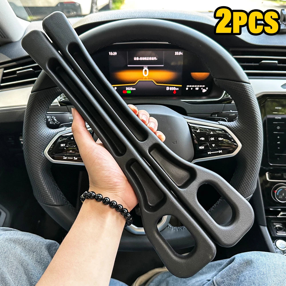 Two black foam car seat gap fillers held in a hand inside a car, with the steering wheel visible
