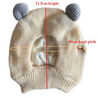 Cream-colored knitted dog ear muffs with gray ear details, laid flat, size measurements shown