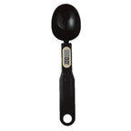 Black digital measuring spoon with a small LCD screen on the handle, shown on a white background