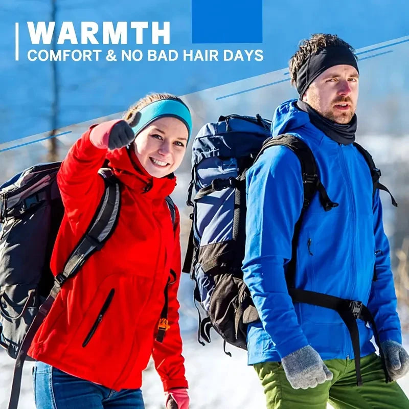 Two people hiking in the snow, each wearing a fleece ear warmer headband, one teal and one black