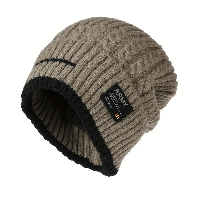Taupe cable knit winter beanie with black trim and a small black patch, shown angled on white
