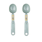 Two grey digital measuring spoon scales with display screens, shown side by side on a white background
