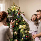 Gold ribbon string lights glowing on a Christmas tree, with a family decorating and taking photos