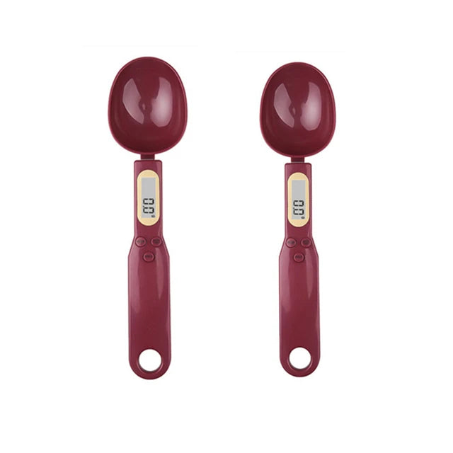 Two maroon digital measuring spoons with LCD displays, shown upright on a white background