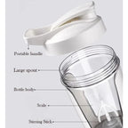 Clear electric protein shaker cup with white lid, shown open and labeled parts including scale and stirrer