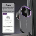 Grey rechargeable lint remover with LED display, purple trim, shown upright beside included accessories