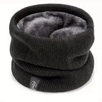 Black knitted winter neck warmer with soft grey fleece lining, shown standing upright on a white background