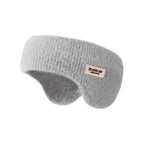 Light grey knit winter ear warmer headband with a small sewn tag, shown against a white background