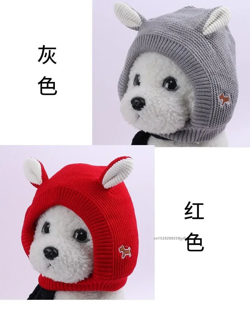 Gray and red knitted dog ear muffs with white ear tips, shown worn on a plush white dog mannequin