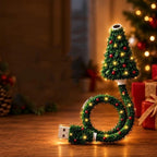 USB-powered flexible projector decorated as a lit Christmas tree, standing on a wooden table