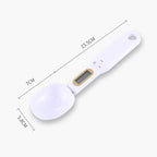 White digital measuring spoon scale with LCD screen and control buttons, size dimensions marked