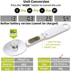 White digital measuring spoon scale with LCD display, control buttons, and a metal weight in the scoop