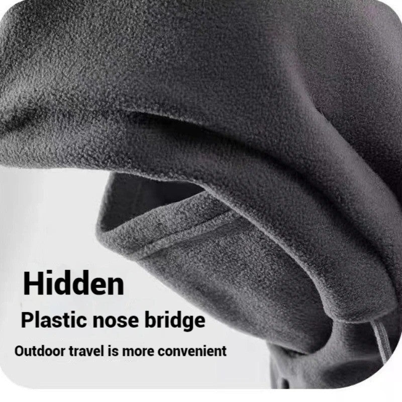 Close-up of a dark gray fleece winter hood showing the nose bridge detail, on a plain background