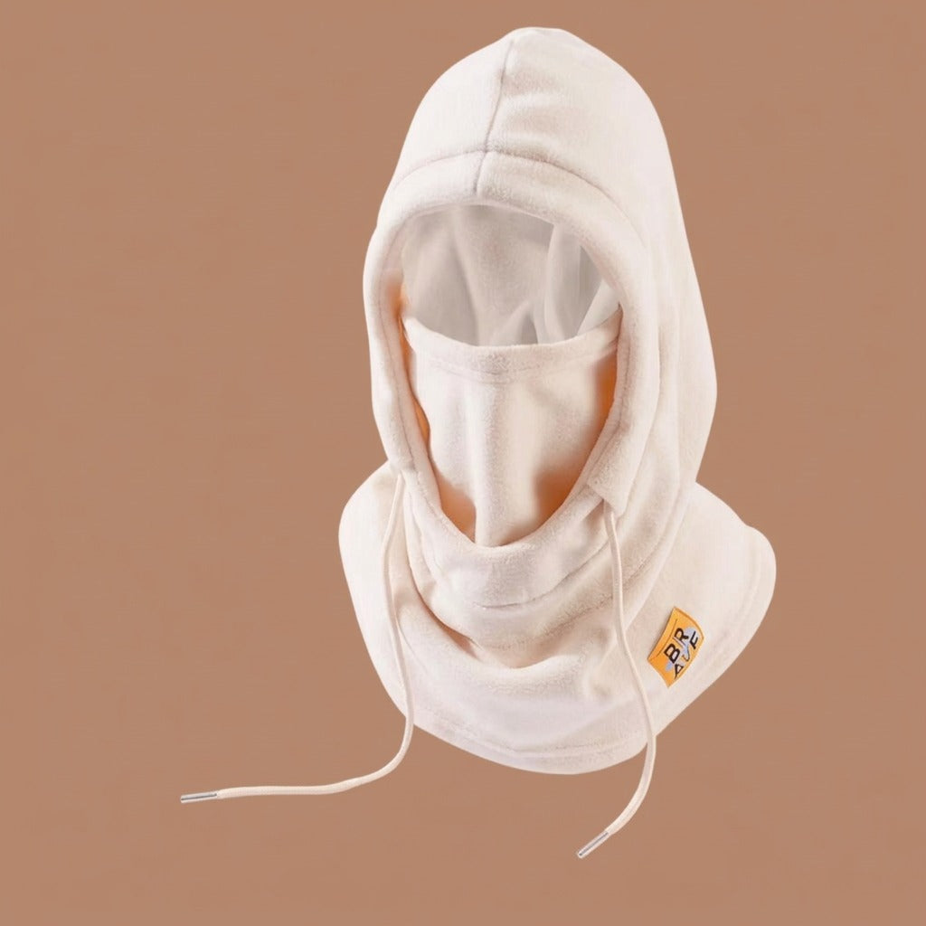 Beige fleece winter hood with drawstrings and face cover, shown against a plain brown background